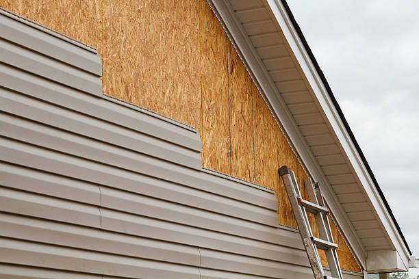 Professional Storm Damage Siding Repair technician working in New Freeport, PA